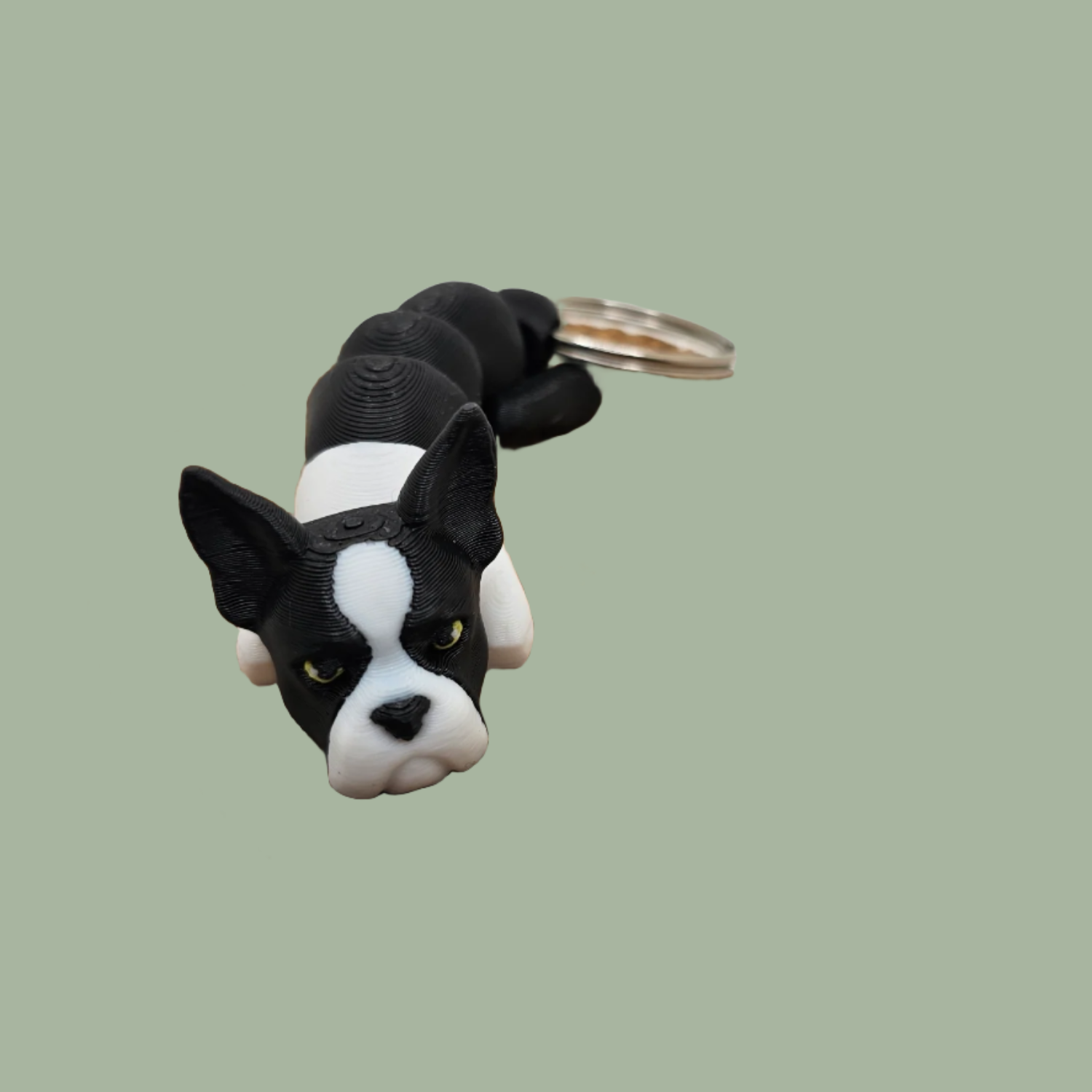 Black and white articulated dog keyring with pointed ears, Boston Terrier/French Bulldog style
